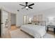 Spacious main bedroom features a ceiling fan, walk-in closet, and light, neutral decor at 1103 Hardwood Dr, Valrico, FL 33596