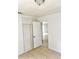 Bedroom featuring tiled floors, closet and white painted walls at 21077 Gertrude Ave, Port Charlotte, FL 33952