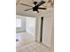 Bedroom featuring tiled floors, white painted walls, and ceiling fan at 21077 Gertrude Ave, Port Charlotte, FL 33952