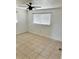 Bedroom with tile flooring and a large window at 21077 Gertrude Ave, Port Charlotte, FL 33952