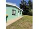 A view of the exterior featuring a grassy lawn at 21077 Gertrude Ave, Port Charlotte, FL 33952