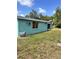 A view of the exterior featuring a grassy lawn at 21077 Gertrude Ave, Port Charlotte, FL 33952
