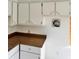 Traditional kitchen with white cabinets and brown countertop, offering ample storage space at 21077 Gertrude Ave, Port Charlotte, FL 33952