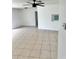 Living room featuring tile floors, neutral walls, and ceiling fan at 21077 Gertrude Ave, Port Charlotte, FL 33952
