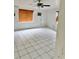 Living room featuring tile floors, neutral walls, and wood blinds at 21077 Gertrude Ave, Port Charlotte, FL 33952