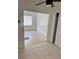 Bright living room featuring tile flooring and white walls with open doorway at 21077 Gertrude Ave, Port Charlotte, FL 33952