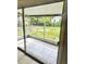 Enclosed porch overlooking the backyard with tiled floor and sliding doors at 21077 Gertrude Ave, Port Charlotte, FL 33952