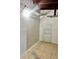 Small storage room with tiled floors, exposed ductwork, and wire shelving at 21077 Gertrude Ave, Port Charlotte, FL 33952