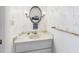Bathroom features a vanity with floral wallpaper and sconce lighting at 2700 Bayshore Blvd # 3210, Dunedin, FL 34698