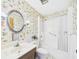 Full bathroom featuring floral wallpaper, standard toilet, shower, and single sink at 2700 Bayshore Blvd # 3210, Dunedin, FL 34698