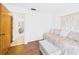 Bright bedroom with daybed, soft lighting, and wood-look floors is perfect for relaxation at 2700 Bayshore Blvd # 3210, Dunedin, FL 34698