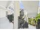 Staircase with railing with a view of a lush courtyard, creating a peaceful and inviting entrance at 2700 Bayshore Blvd # 3210, Dunedin, FL 34698