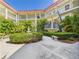 Central courtyard with a fountain and meticulous landscaping, enhancing the charm and appeal of the property at 2700 Bayshore Blvd # 3210, Dunedin, FL 34698
