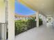 Balcony view overlooking lush courtyard, offering serene outdoor living, and a glimpse of community charm at 2700 Bayshore Blvd # 3210, Dunedin, FL 34698