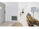 Hallway view with tile floors, leading to the kitchen and featuring a console table at 2700 Bayshore Blvd # 3210, Dunedin, FL 34698