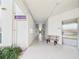 Hallway to apartments 3101-3312 with elevator, mailbox, and bench at 2700 Bayshore Blvd # 3210, Dunedin, FL 34698