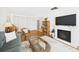Comfortable living room with a fireplace, woven coffee table, and a view of a spacious closet at 2700 Bayshore Blvd # 3210, Dunedin, FL 34698