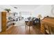 Well-lit living room with wood floors, fireplace, and comfortable seating area at 2700 Bayshore Blvd # 3210, Dunedin, FL 34698