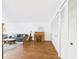 Living room with wood floors, a desk, and an array of closets at 2700 Bayshore Blvd # 3210, Dunedin, FL 34698
