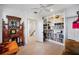 Bedroom featuring custom built-in bookshelves, hardwood floors, and modern decor at 1007 N Wheeler St, Plant City, FL 33563