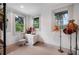 Bedroom featuring three windows, hardwood floors, and decorative vintage lamps at 1007 N Wheeler St, Plant City, FL 33563