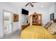 Comfortable bedroom featuring hardwood floors, a large wardrobe, and access to an ensuite bathroom at 1007 N Wheeler St, Plant City, FL 33563