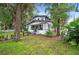 Inviting two-story home with charming front porch and mature landscaping at 1007 N Wheeler St, Plant City, FL 33563