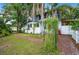 Charming home exterior showcasing lush landscaping, a brick pathway, and a welcoming front porch at 1007 N Wheeler St, Plant City, FL 33563