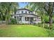 Two-story home with inviting front porch and well-manicured landscaping at 1007 N Wheeler St, Plant City, FL 33563