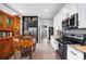 Bright kitchen featuring black and white cabinetry, stainless steel appliances, and granite countertops at 1007 N Wheeler St, Plant City, FL 33563
