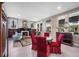 Spacious living room featuring a fireplace, elegant furniture, and plenty of natural light at 1007 N Wheeler St, Plant City, FL 33563
