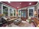 Sophisticated living room featuring a vintage-style sofa, ornate furniture, and natural light at 1007 N Wheeler St, Plant City, FL 33563