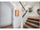 Stairway with white banister, carpeted stairs, and window allowing natural light at 1007 N Wheeler St, Plant City, FL 33563