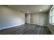 Bright bedroom with updated flooring, neutral walls, large windows, and ample closet space at 1735 Council Dr, Sun City Center, FL 33573