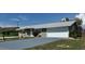Charming single-Gathering home featuring a neatly painted exterior, gray roof, and a convenient two-car garage at 1735 Council Dr, Sun City Center, FL 33573
