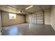 Spacious two car garage with painted floor and new garage door at 1735 Council Dr, Sun City Center, FL 33573