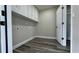 Functional laundry area equipped with built-in cabinets and space for modern appliances at 1735 Council Dr, Sun City Center, FL 33573