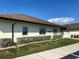 Exterior view of the community library with manicured landscaping, and ample parking at 1735 Council Dr, Sun City Center, FL 33573