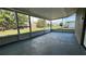 Large screened in porch with views of the backyard at 1735 Council Dr, Sun City Center, FL 33573