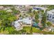 Aerial view of home with lush surroundings and screened-in pool in a vibrant neighborhood at 3620 E Tampa Cir, Tampa, FL 33629