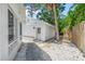 A quaint backyard space featuring fresh gravel and a fenced perimeter, perfect for outdoor enjoyment at 3620 E Tampa Cir, Tampa, FL 33629