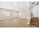 Finished basement with recessed lighting, windows, and stairs for easy access at 3620 E Tampa Cir, Tampa, FL 33629