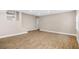 This finished basement offers neutral walls and laminate floors at 3620 E Tampa Cir, Tampa, FL 33629