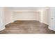 Open basement area with laminate flooring, neutral paint, and plenty of open space to enjoy at 3620 E Tampa Cir, Tampa, FL 33629