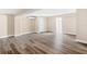Finished basement featuring LVP flooring, neutral paint, a mini-split unit, and an adjacent doorway at 3620 E Tampa Cir, Tampa, FL 33629