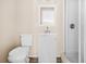 Cozy bathroom features a modern vanity, toilet, and shower, creating a comfortable and functional space at 3620 E Tampa Cir, Tampa, FL 33629