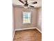 Comfortable bedroom featuring new flooring and ceiling fan and window at 3620 E Tampa Cir, Tampa, FL 33629