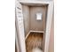 Walk-in closet with modern wood floors and neutral paint at 3620 E Tampa Cir, Tampa, FL 33629