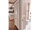 Bright hallway with a closet, bathroom, and a glimpse of the kitchen at 3620 E Tampa Cir, Tampa, FL 33629