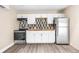 Updated kitchen with stainless steel appliances and sleek countertops, offering a stylish cooking space at 3620 E Tampa Cir, Tampa, FL 33629